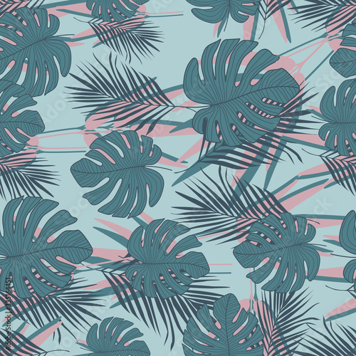 Exotic tropical leaves seamless pattern on blue background. Trendy botanical leaf wallpaper.