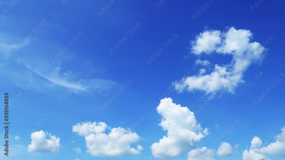 Beautiful Sunny blue sky & white cumulus clouds formation building TimeLapse. Nature texture background of Moving cloudscape in tropical bright summer vibes sunlight at scenic relax sunshine day Beautiful Sunny blue sky & white cumulus clouds formation building TimeLapse. Nature texture background of Moving cloudscape in tropical bright summer vibes sunlight at scenic relax sunshine day