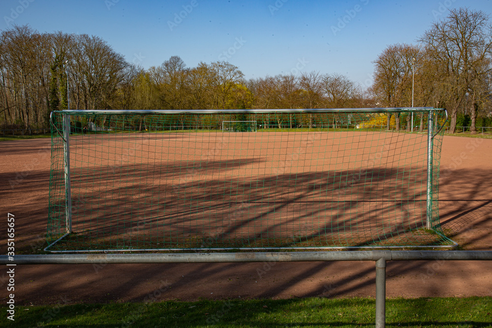 Fototapeta premium empty football ground in the sun based on championship interruption because of corona