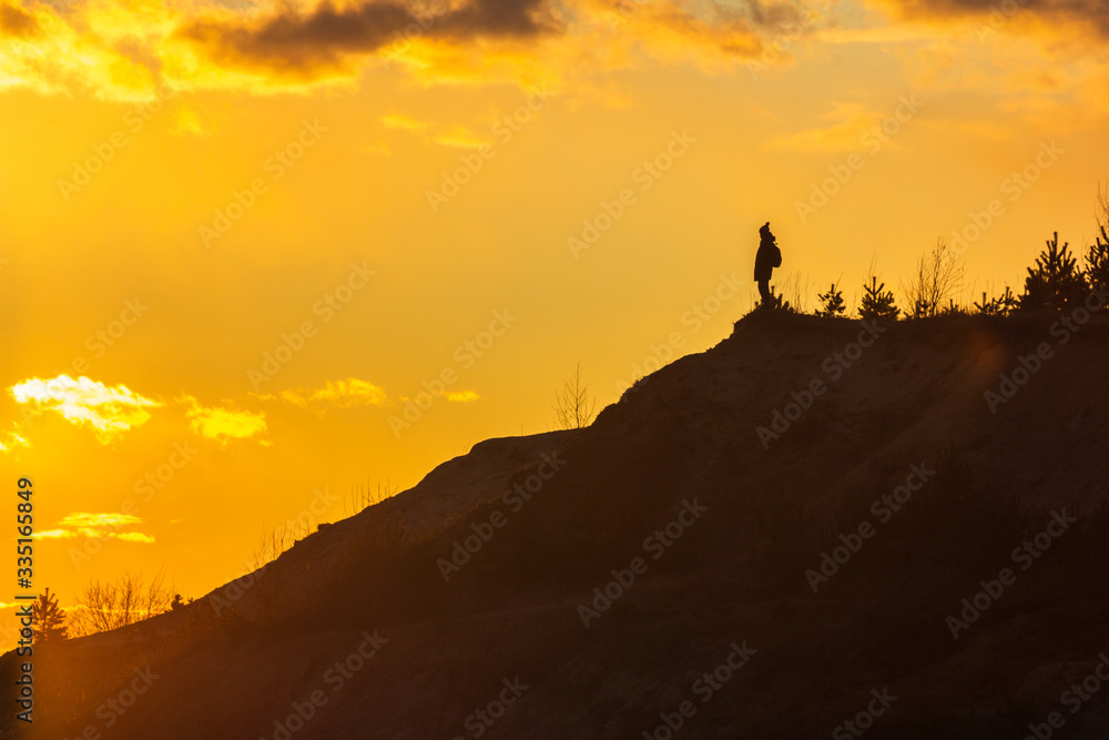 man on top of a mountain sunset harmony adventure