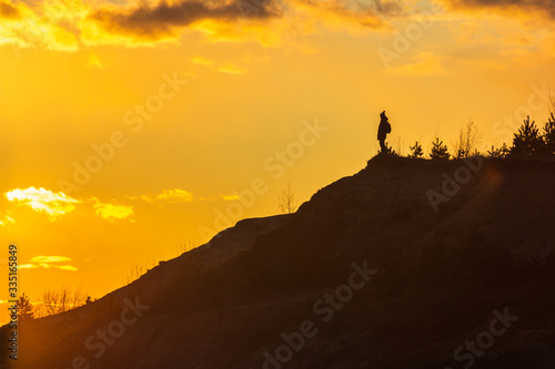 man on top of a mountain sunset harmony adventure