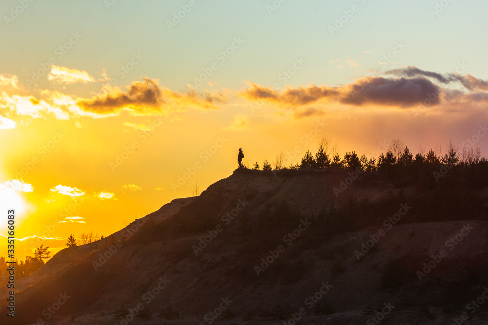 man nature lover on top of a mountain sunset dream