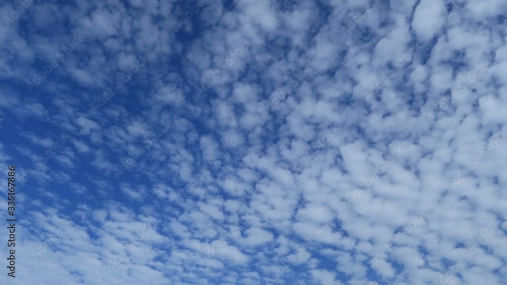 Tropical summer blue sky with cotton candy white cirocumulus & cumulus clouds moving in sunny & sunshine day, TimeLapse. Transitional & meditative time lapse video for digital cinema composition Tropical summer blue sky with cotton candy white cirocumulus & cumulus clouds moving in sunny & sunshine day, TimeLapse. Transitional & meditative time lapse video for digital cinema composition