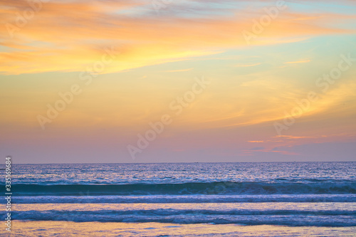 Incredibly colorful sunset on the tropical beach. Abstract nature background.