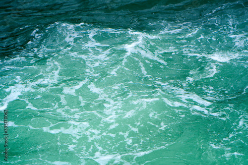 Waves on the green ocean water. Abstract nature background. © Ruslan Kokarev