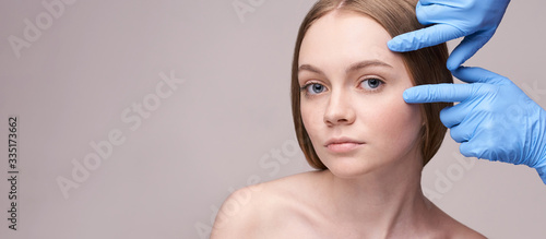 Young pretty woman studio portrait. Cosmetology concept. Esthetic woman face. Skin care dermatology beauty contour. Harmony girl. For cream, lotion horizontal banner. Copyspace photo