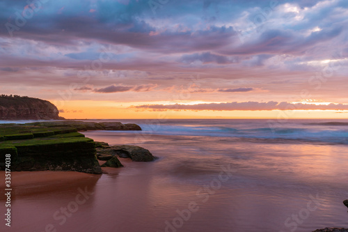 Cloudy dawn at Turimetta Beach, Sydney, during low tide. © AlexandraDaryl