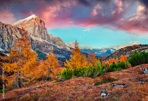 Astonishing view from top of Falzarego pass with Lagazuoi mountain. Fantastic autumn sunrise on Dolomite Alps, Cortina d'Ampezzo lacattion, Italy, Europe. Beauty of nature concept background..
