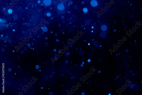 Blur blue bokeh of light on black
