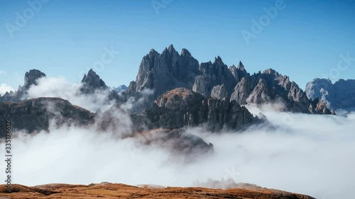Looks like a heaven. The peaks of the mountains stifle from a going thick fog. Unbelievable photo takes.