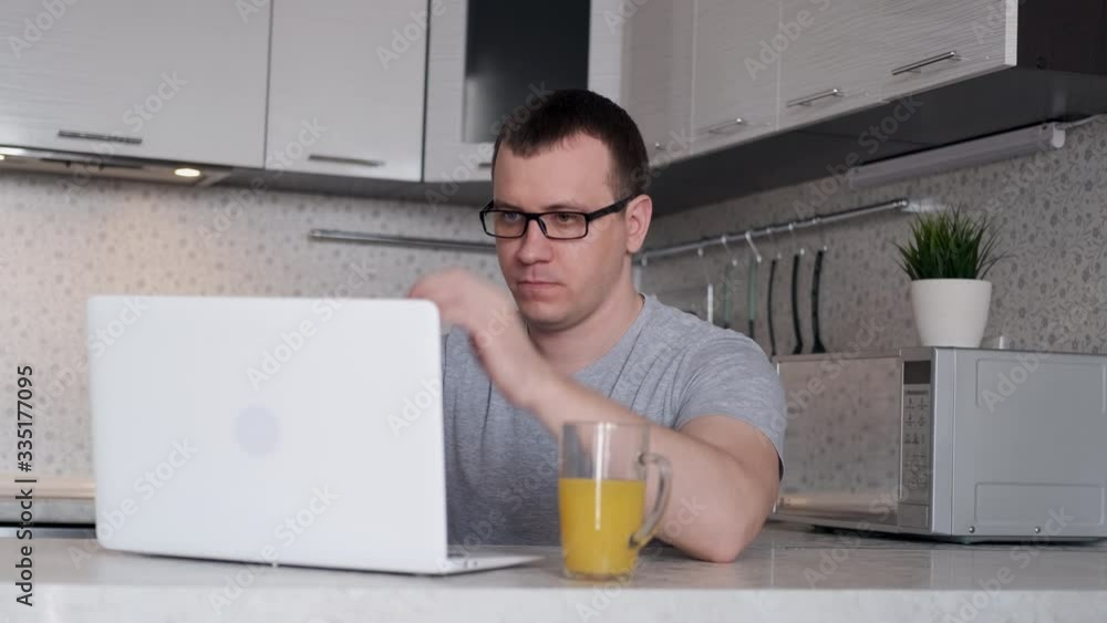 A young man is having difficulty working remotely from home. slow motion A young man is having difficulty working remotely from home. slow motion