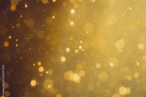 Dark Abstract Gold bokeh sparkle on black