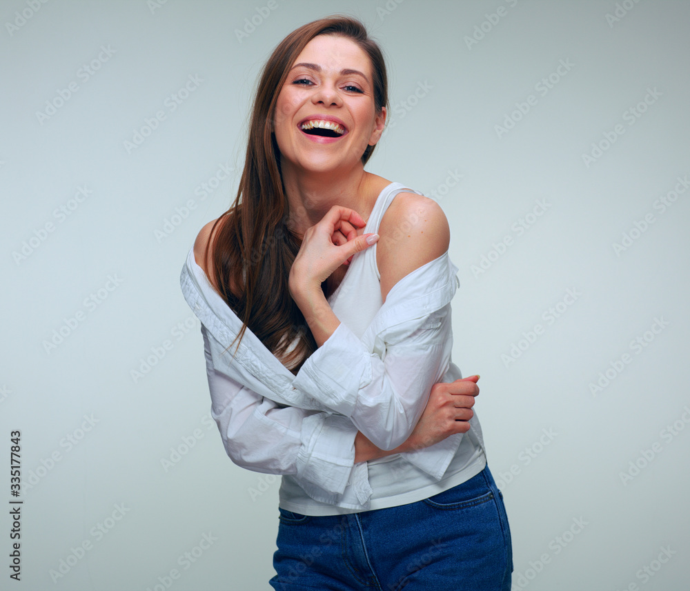 Young pretty woman wearing white shirt posing with naked shoulders. Young pretty woman wearing white shirt posing with naked shoulders.