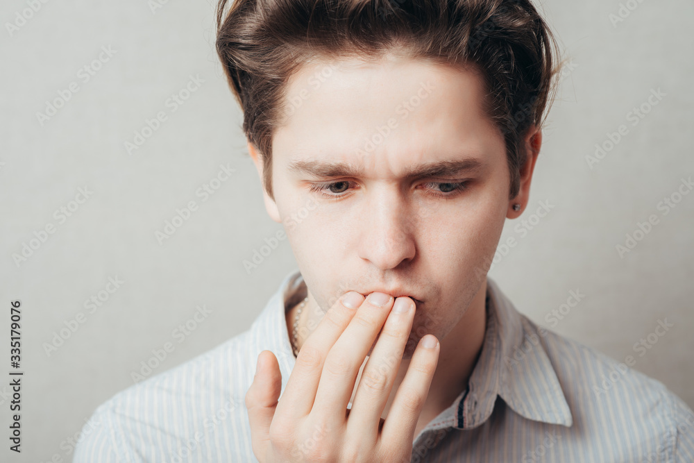 male of European appearance covers her mouth yawning, yawning and drowsiness cross process male of European appearance covers her mouth yawning, yawning and drowsiness cross process