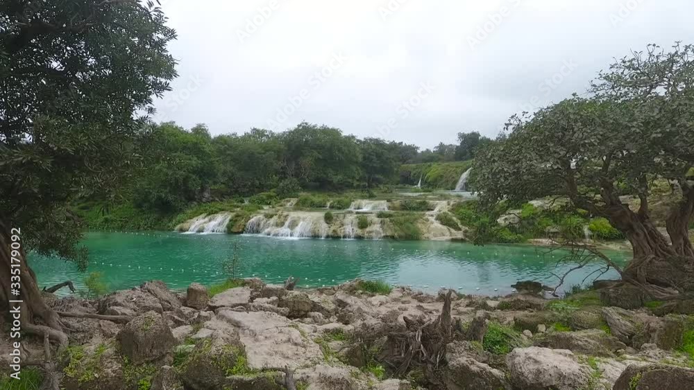 A surprising snapshot of the drone in the fall in Salalah, Ain Darbat, Sultanate of Oman A surprising snapshot of the drone in the fall in Salalah, Ain Darbat, Sultanate of Oman