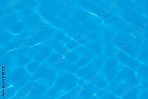 Blue water ripple reflection in the swimming pool