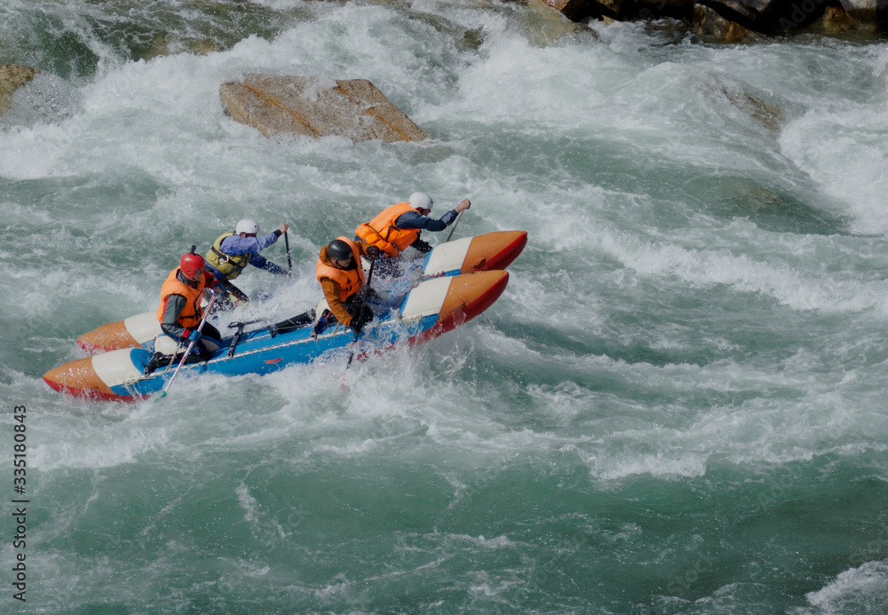 Extreme catamaran rafting on the mountain rivers of the Tien Shan