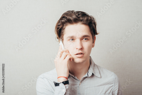 young man talking on a cell phone