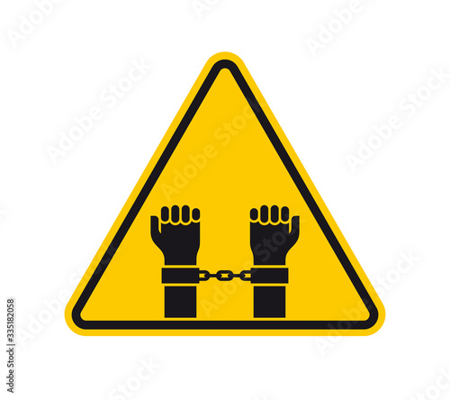 Vector yellow triangle sign - black silhouette hands in handcuffs. Isolated on white background.