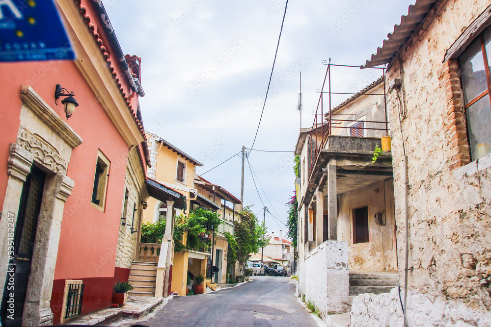 Corfu historical heritage, architecture, streets, buildings, patios, doors, windows and vegetation, Greece, summer