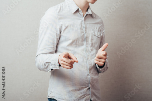 young man pointing to you