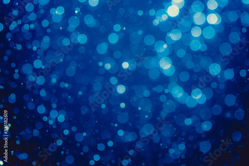 Abstract blue defocused bokeh of lights in dark © pandaclub23