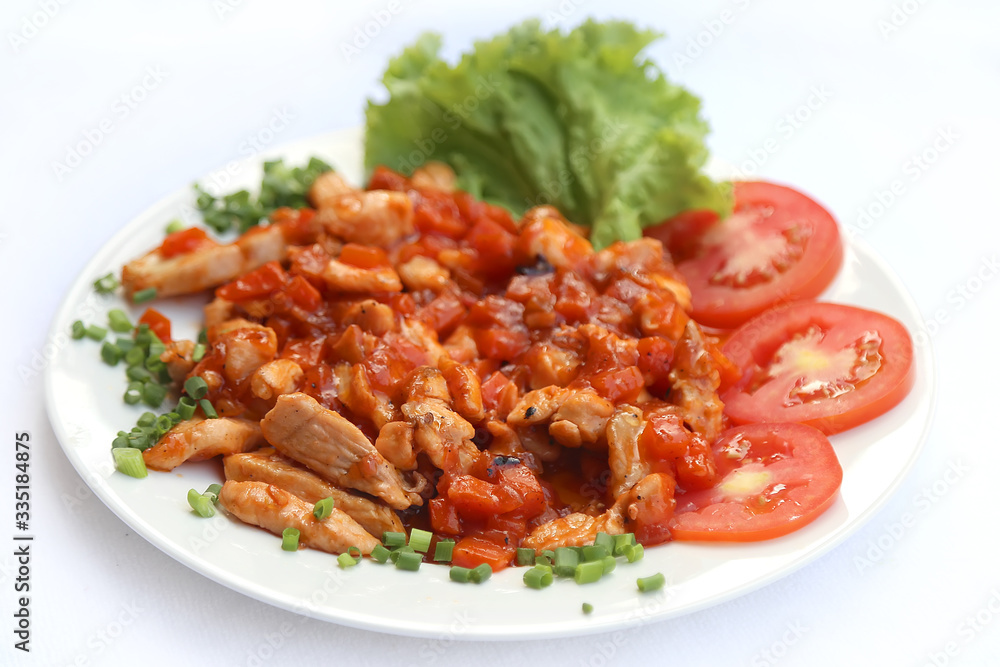 Fried pork with vegetables, dishes of Russian national cuisine Fried pork with vegetables, dishes of Russian national cuisine
