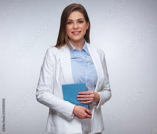 Wallpaper Mural Smiling business teacher, woman holding book Torontodigital.ca