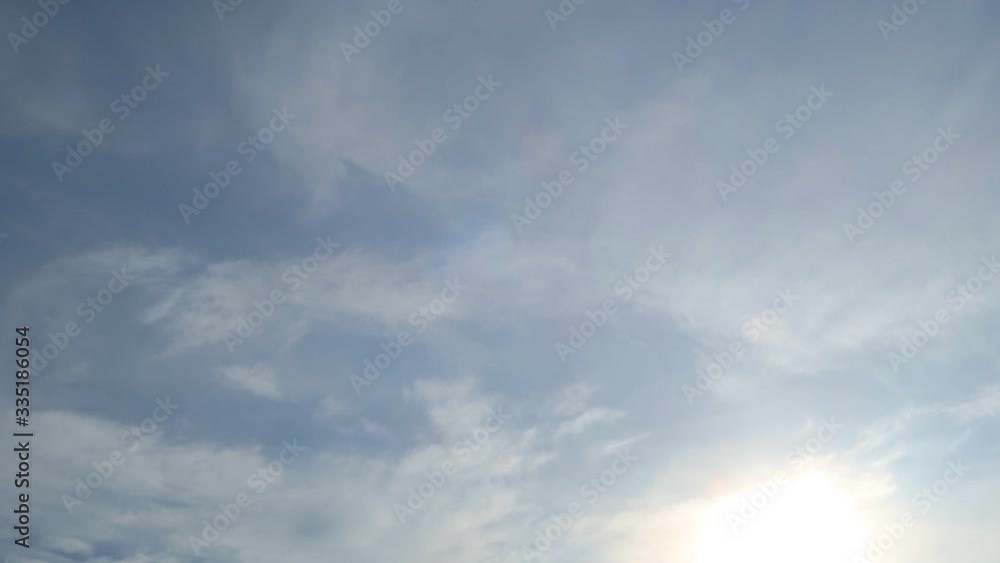 TimeLapse of nature sunrise in summer morning sunlight & bright sun rays with white cirrus clouds moving slowly on vivid wispy smoke sky at tropical sunny & sunshine day, beautiful weather concept TimeLapse of nature sunrise in summer morning sunlight & bright sun rays with white cirrus clouds moving slowly on vivid wispy smoke sky at tropical sunny & sunshine day, beautiful weather concept