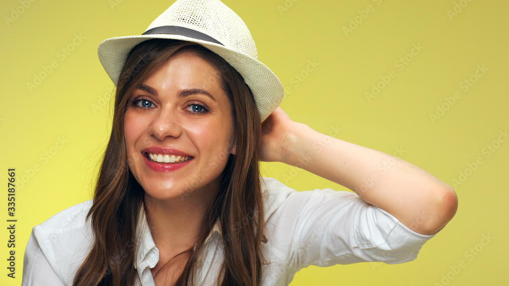 face portrait of smiling woman touching her hat face portrait of smiling woman touching her hat