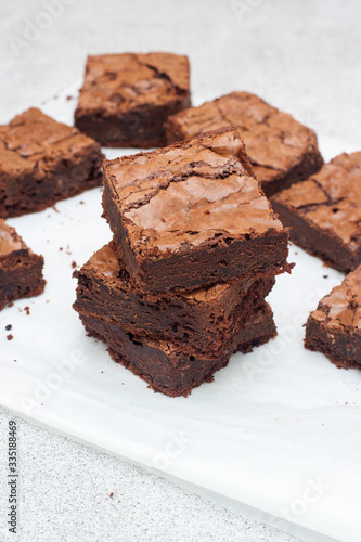Freshly baked chocolate chewy brownie, cut into nine square pieces.