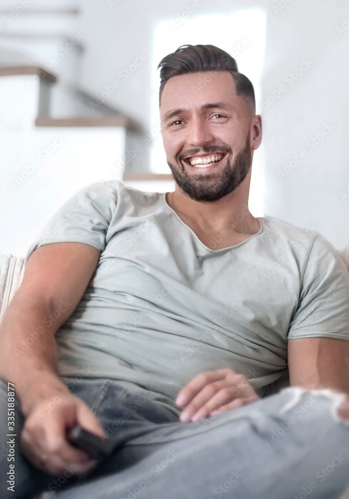 close up. young man sitting on sofa. close up. young man sitting on sofa.