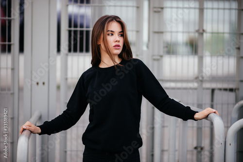 Free Download Fashion portrait of a young beautiful brunette girl with long black straight flying hair. Magnificent hair. Black roll neck jumper. - GFXLoad