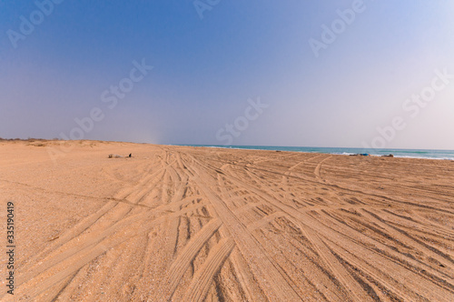 Empty sandy beach and blue sky