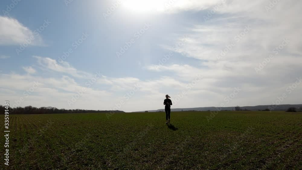 The girl is engaged in running in nature The girl is engaged in running in nature
