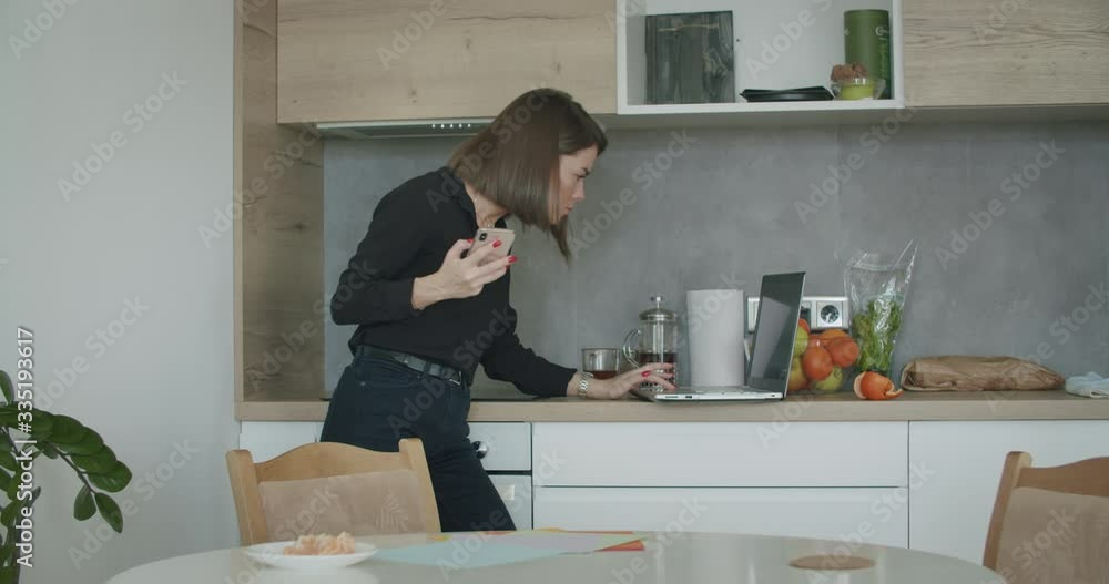 Woman checking good news on smart phone Woman checking good news on smart phone
