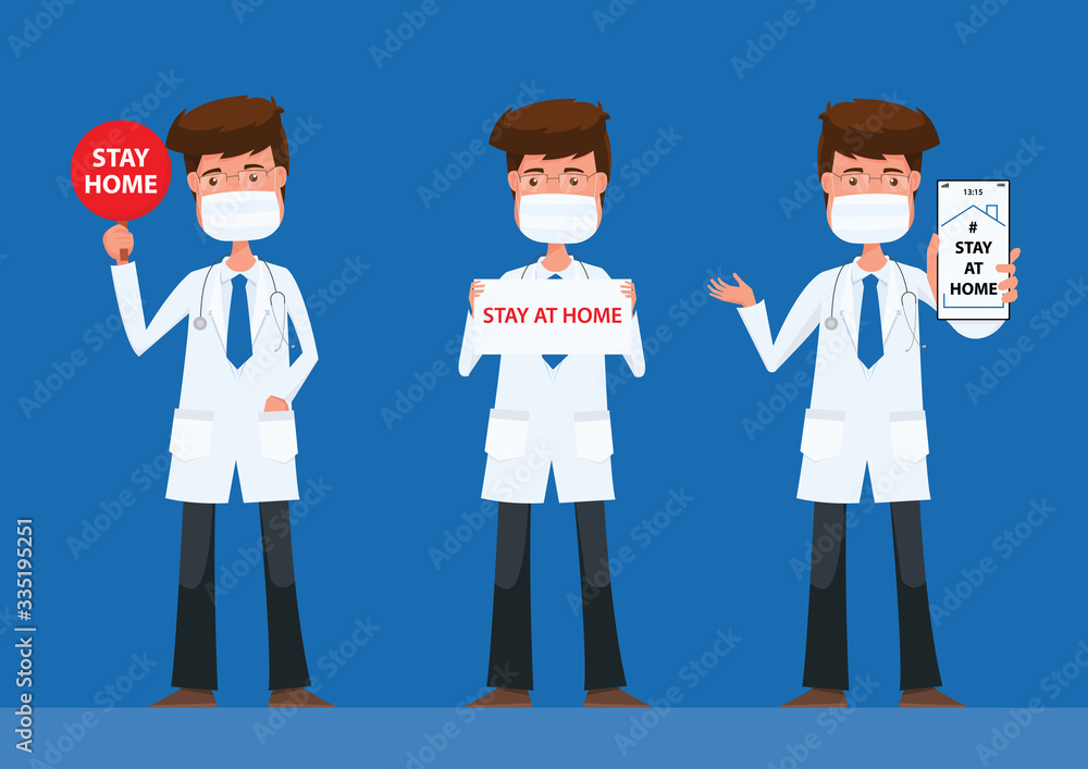The doctors stand holding a sign Stay at Home. The doctors stand holding a sign Stay at Home.