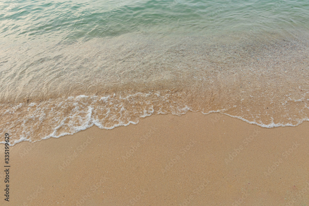 Soft waves of the ocean on the sandy beach, summer beach, soft wave bubbles on the sandy beach
Soft waves of the ocean on the sandy beach, summer beach, soft wave bubbles on the sandy beach