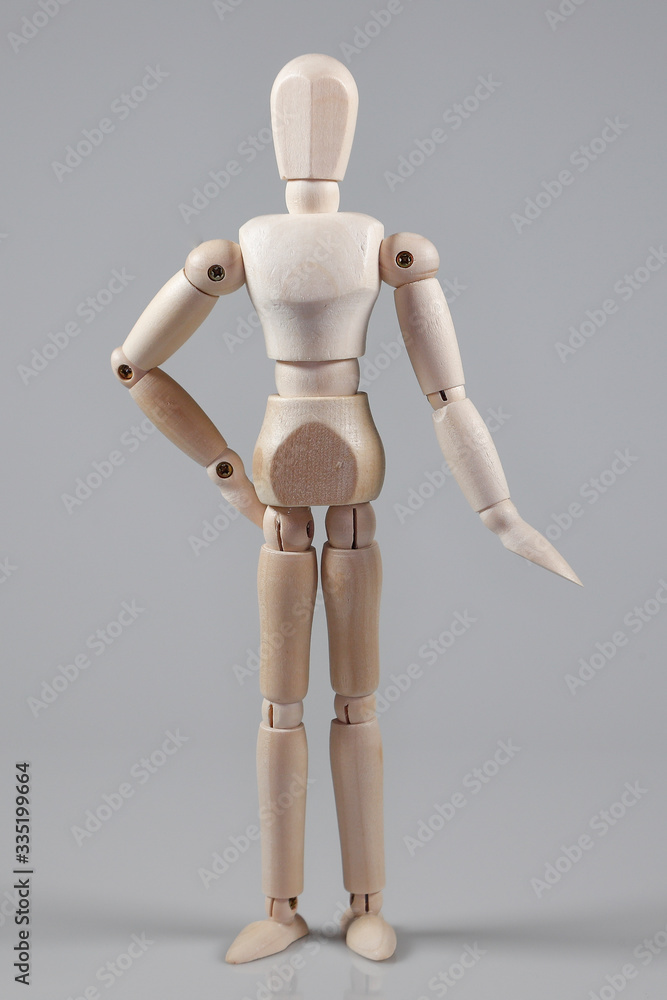 Wooden Mannequin on gray background Wooden Mannequin on gray background