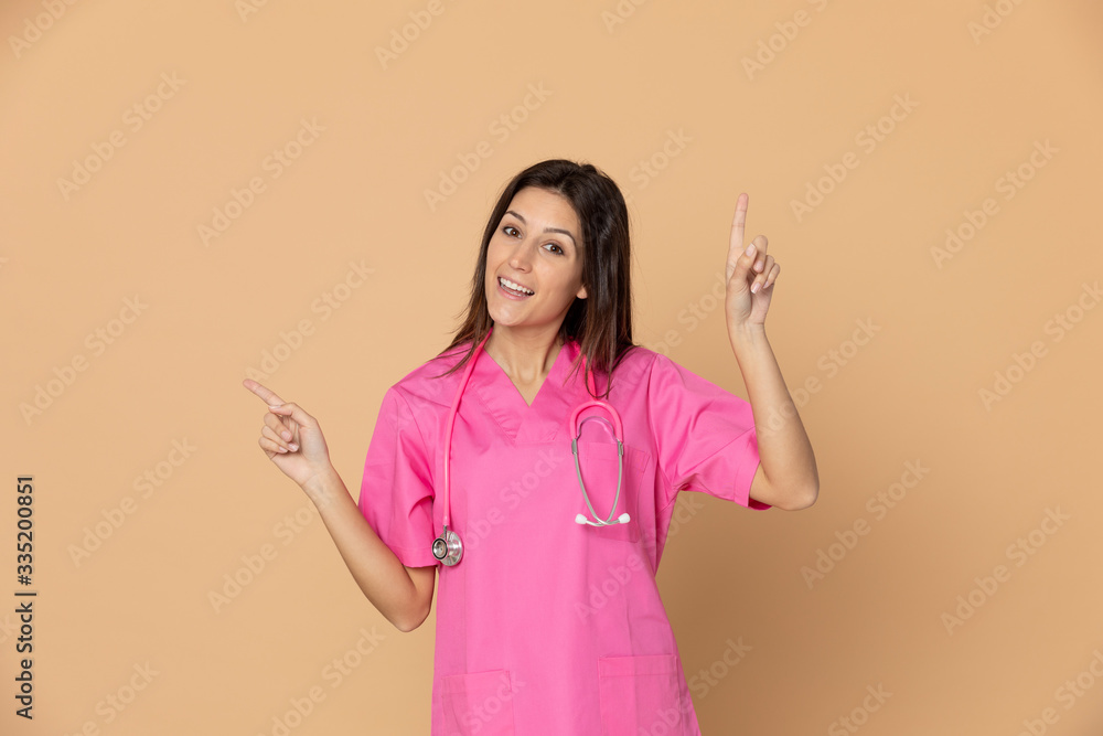 Young doctor wearing pink uniform Young doctor wearing pink uniform
