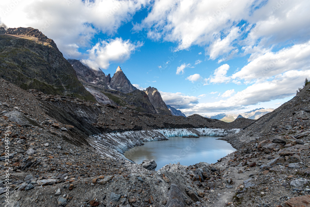 The Miage lake (Lac du Miage)  and Miage glacier at the foot of the Mont Blanc massif, in Val Veny. Italian alps, Aosta Valley, Italy