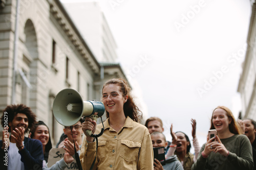 Woman with group of people in a rally