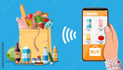 Hand holding smartphone with shopping app. Grocery store delivery. Internet order. Online supermaket. Paper shopping bag with food and drinks. Milk, vegetables, meat, cheese. Flat vector illustration