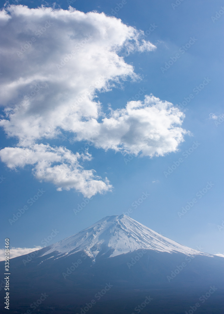 The highest mountain in Japan, Mt. Fuji, with clouds that look like smoke coming up from the mountain