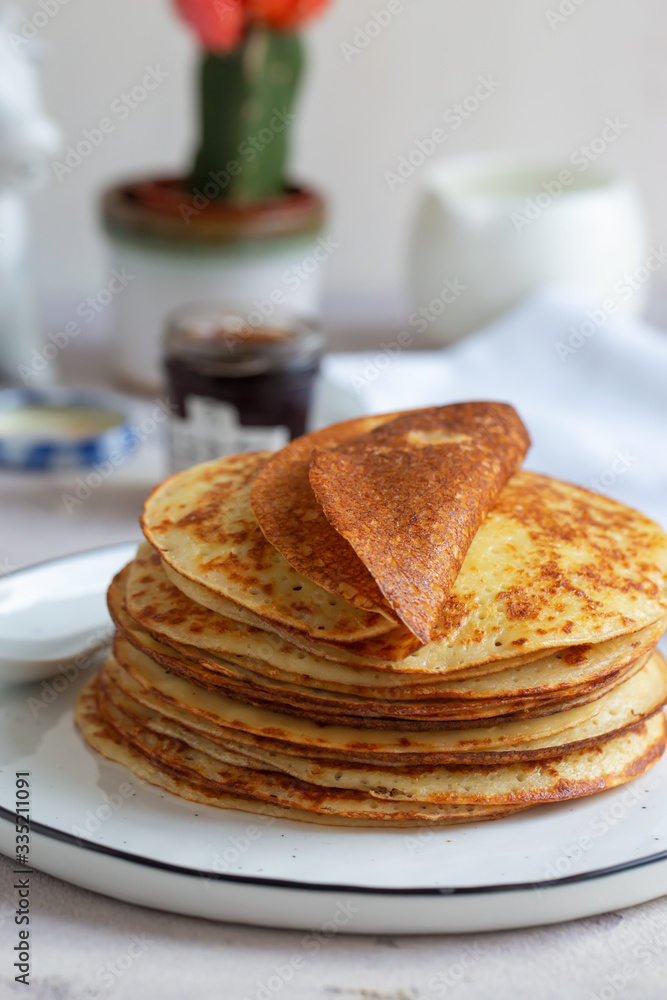 Fresh baked french crepes or Russians blinis on beautiful plate. Fresh baked french crepes or Russians blinis on beautiful plate.