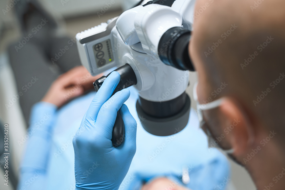 Dentist working with modern technology stock photo