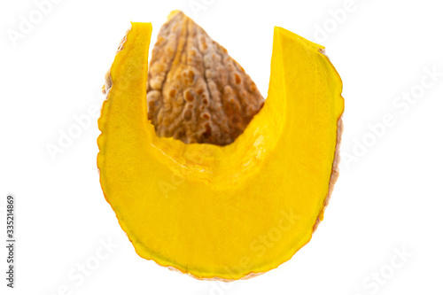 Slice of ripe yellow pumpkin on a white background.	