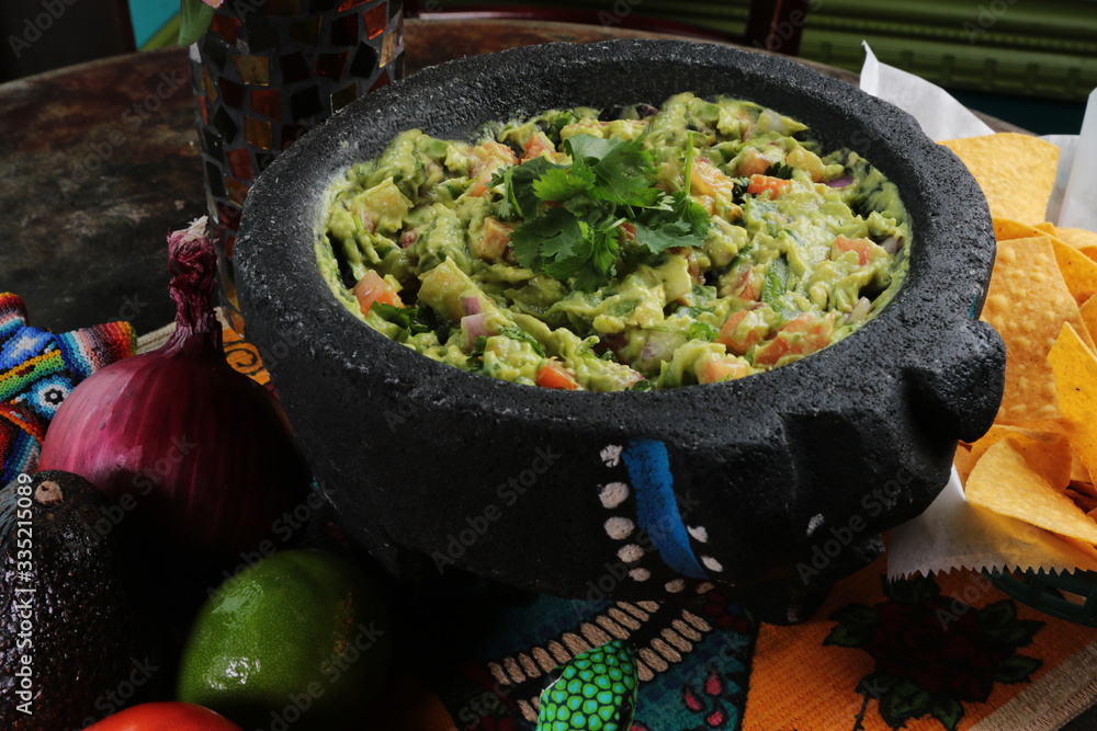 mexican guacamole made in a mortero bowl