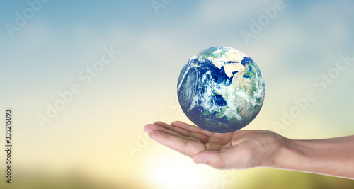 Globe   earth in human hand  holding our planet glowing.  image provided by Nasa
