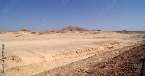 Beautiful panorama of the Sinai Desert. Mountains and sands of different shades. Clear blue sky